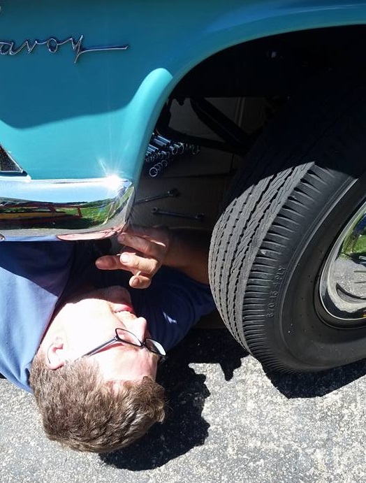 guy working on a car